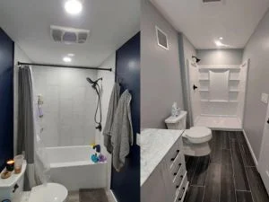 Dark wood-look tile flooring installed in bathroom with navy walls and white fixtures